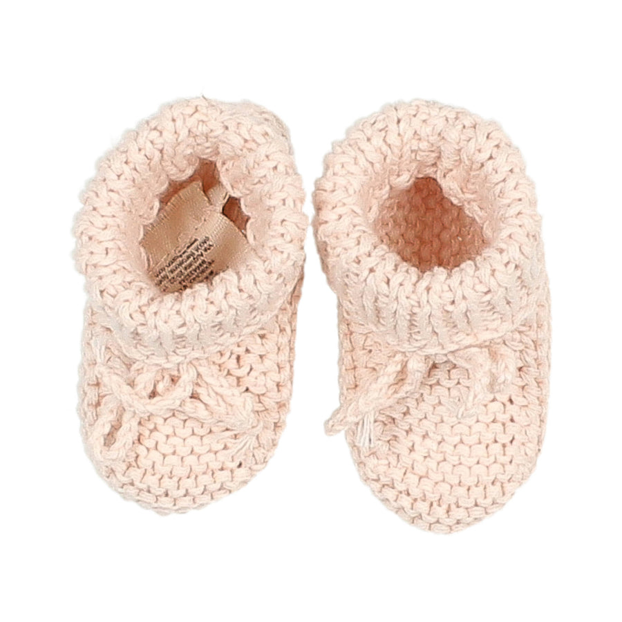 Chaussons en maille rose de chez Buho